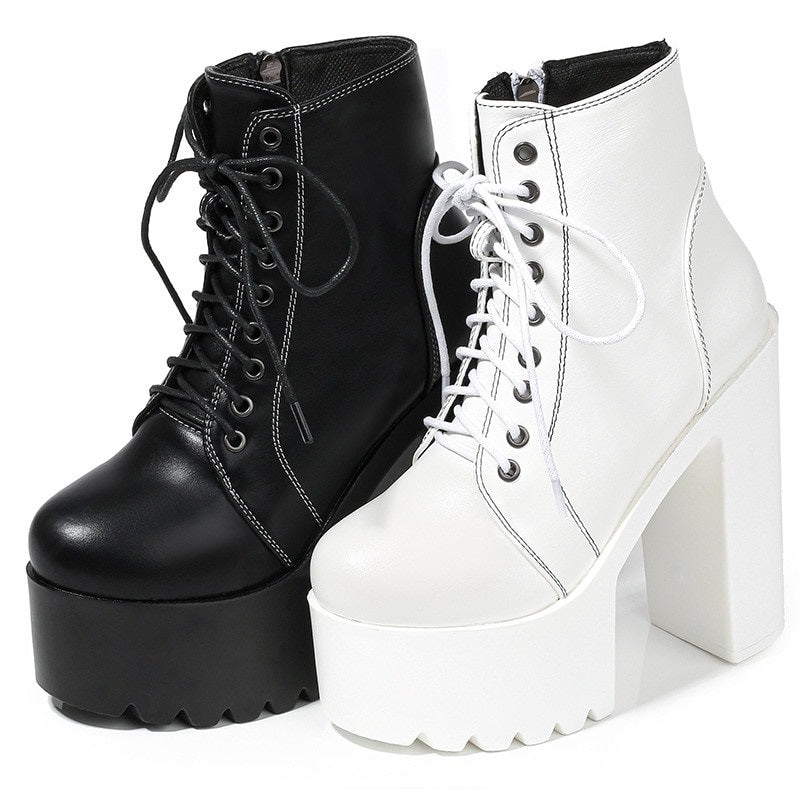 Gothic high heel ankle boots in black and white, featuring zippers and laces for a stylish, edgy look.