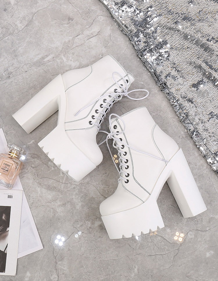 White high heel ankle boots with laces, perfect for goth outfits and stylish ensembles.