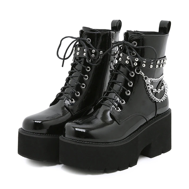 Stylish women's patent leather motorcycle ankle boots with metal chains and platform soles.
