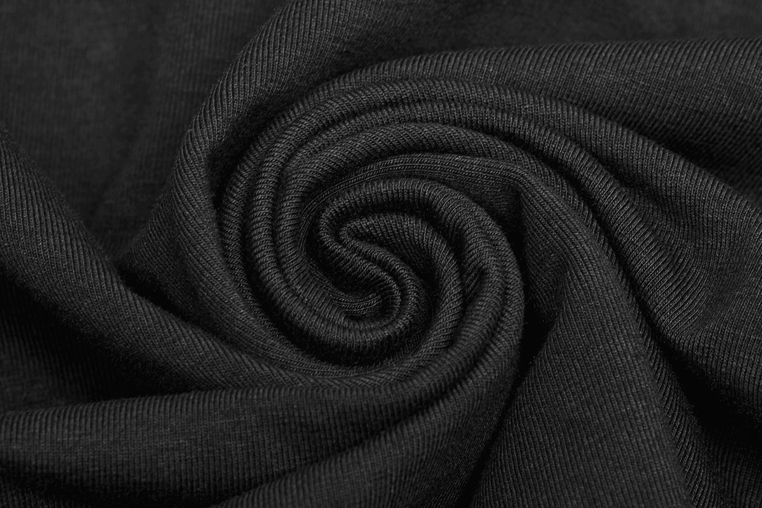 Close-up of black fabric showcasing a soft, textured knit ideal for stylish sweatshirts.