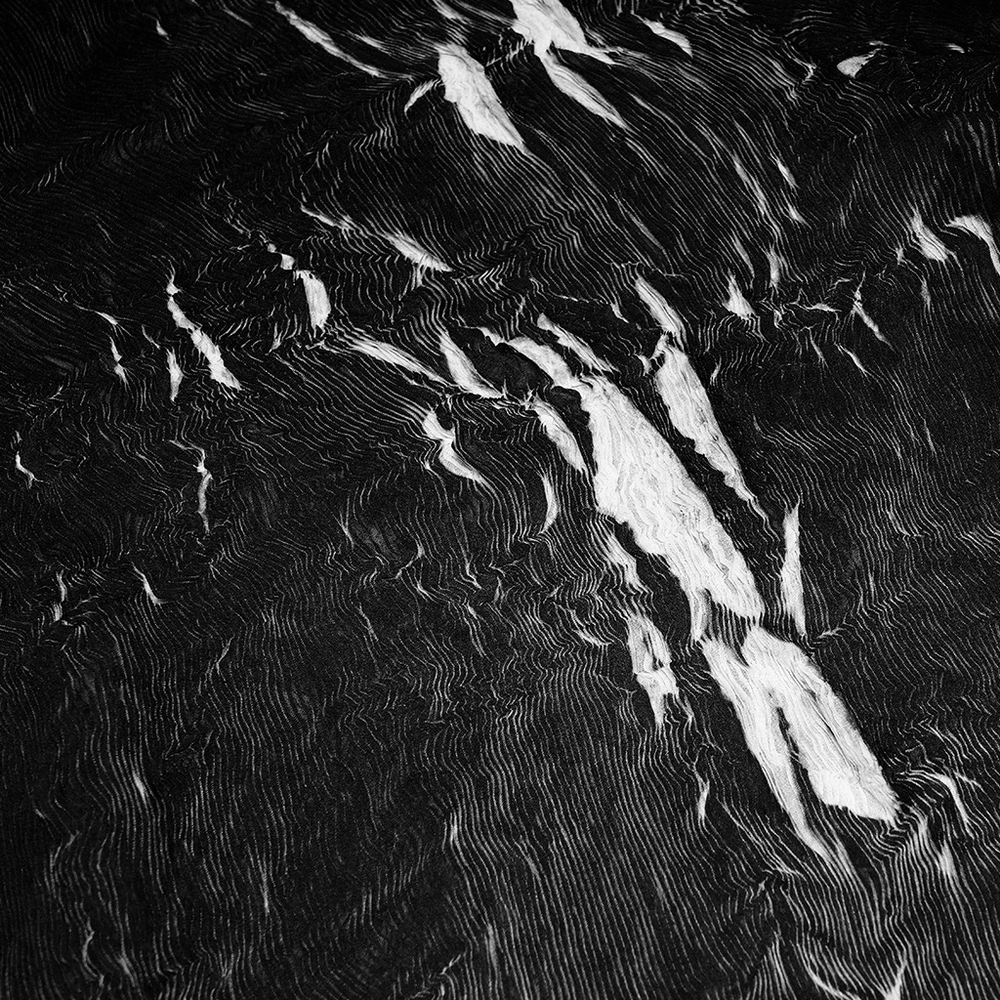 Abstract marble texture in black and white, showcasing unique swirling patterns and gothic elegance.