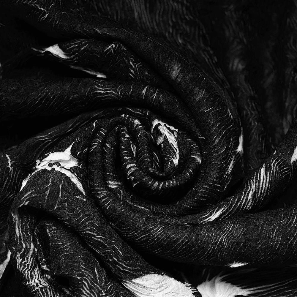 Close-up of abstract marble gothic fabric featuring a swirling black and white texture, ideal for stylish fitted tops.