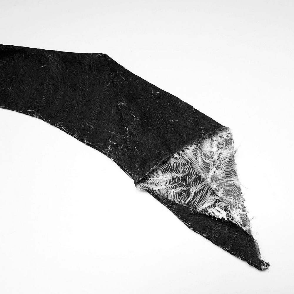 Close-up of black abstract textured fabric showcasing its unique pattern and soft interior.