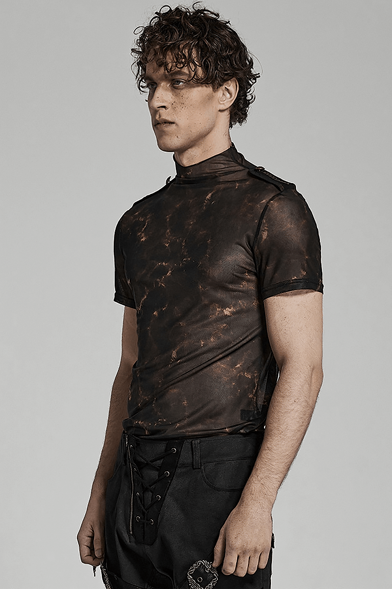 Stylish man wearing an abstract print stretch mesh tee with 3D lace shoulders, perfect for an edgy look.