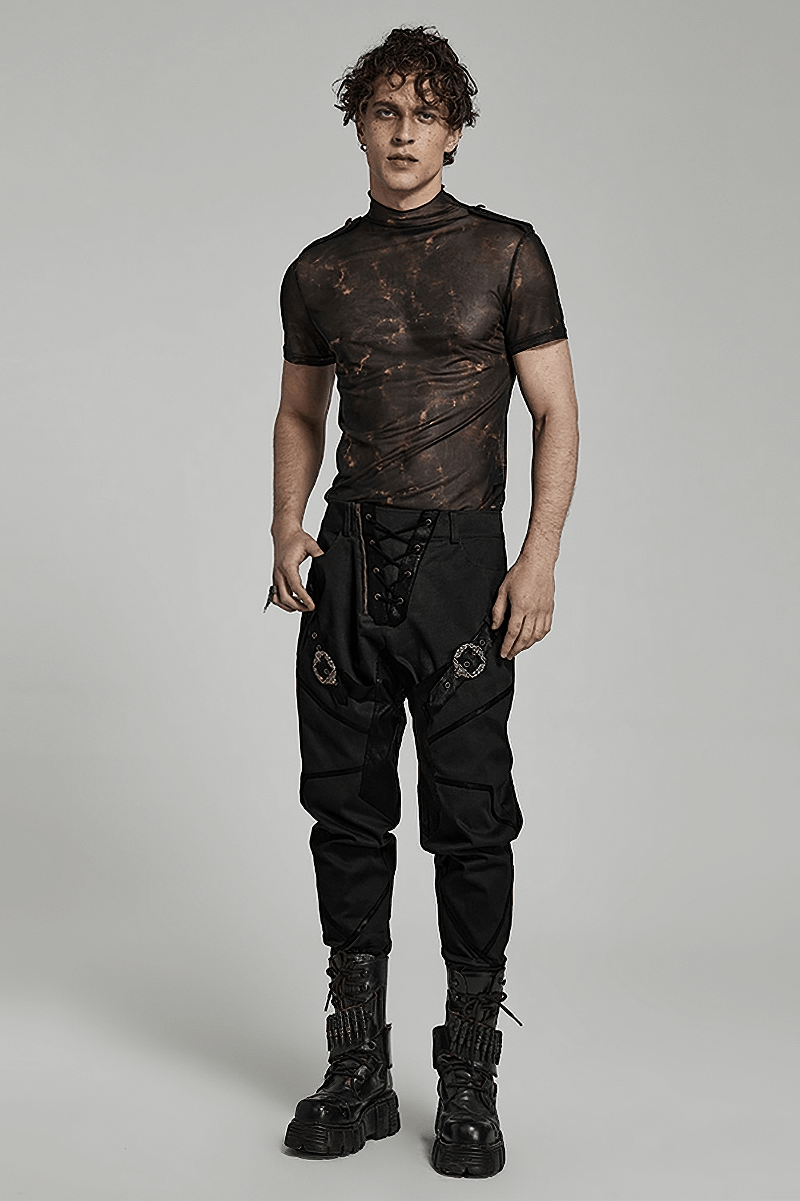 Model wearing an Abstract Print Stretch Mesh Tee with 3D Lace Shoulders and stylish black joggers, showcasing edgy fashion.