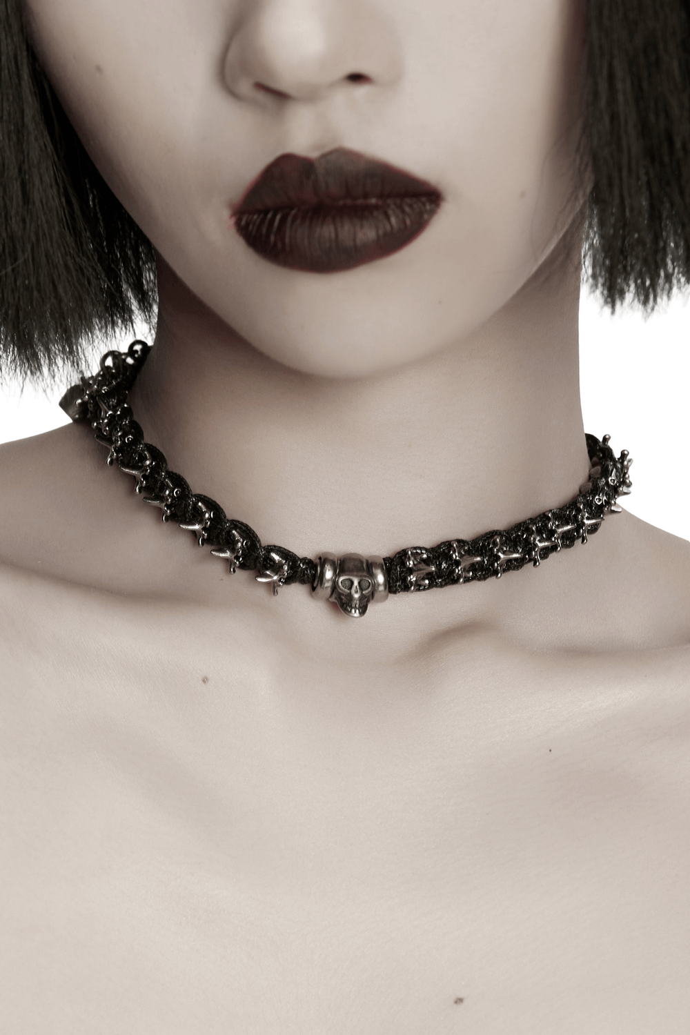Adjustable Gothic Punk Necklace with Skull and Spine Beads showcased on model with dark lipstick.