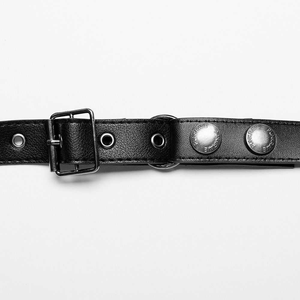 Close-up of adjustable punk Y-shape PU leather shoulder harness with silver snaps and buckle.