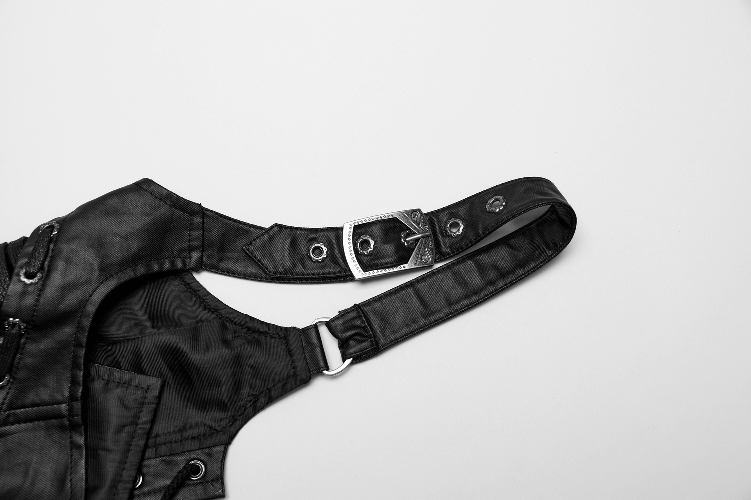 Adjustable strap of a black gothic corset featuring a metallic buckle and intricate detailing.