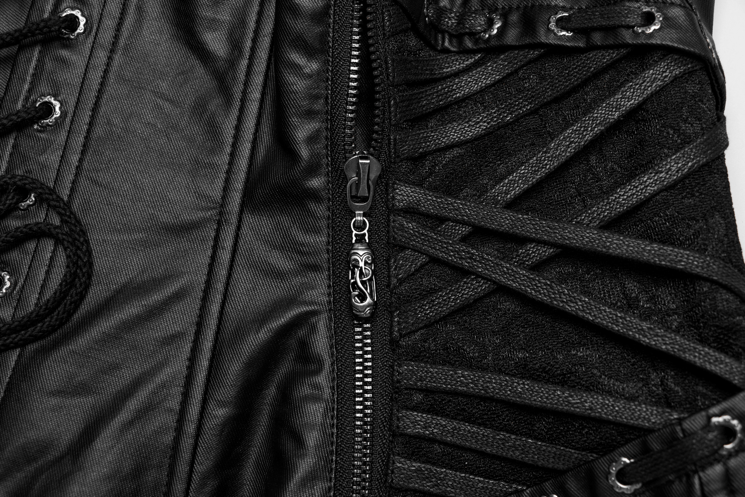 Close-up of adjustable black gothic corset with lace-up details and side zipper for a perfect fit.