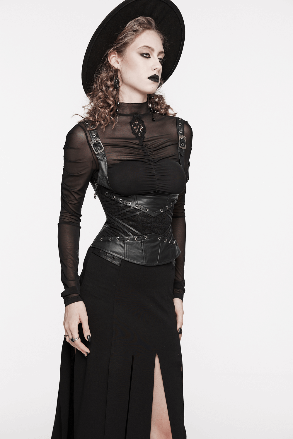 Model wearing a black gothic corset with adjustable straps, styled for an edgy and dark look.