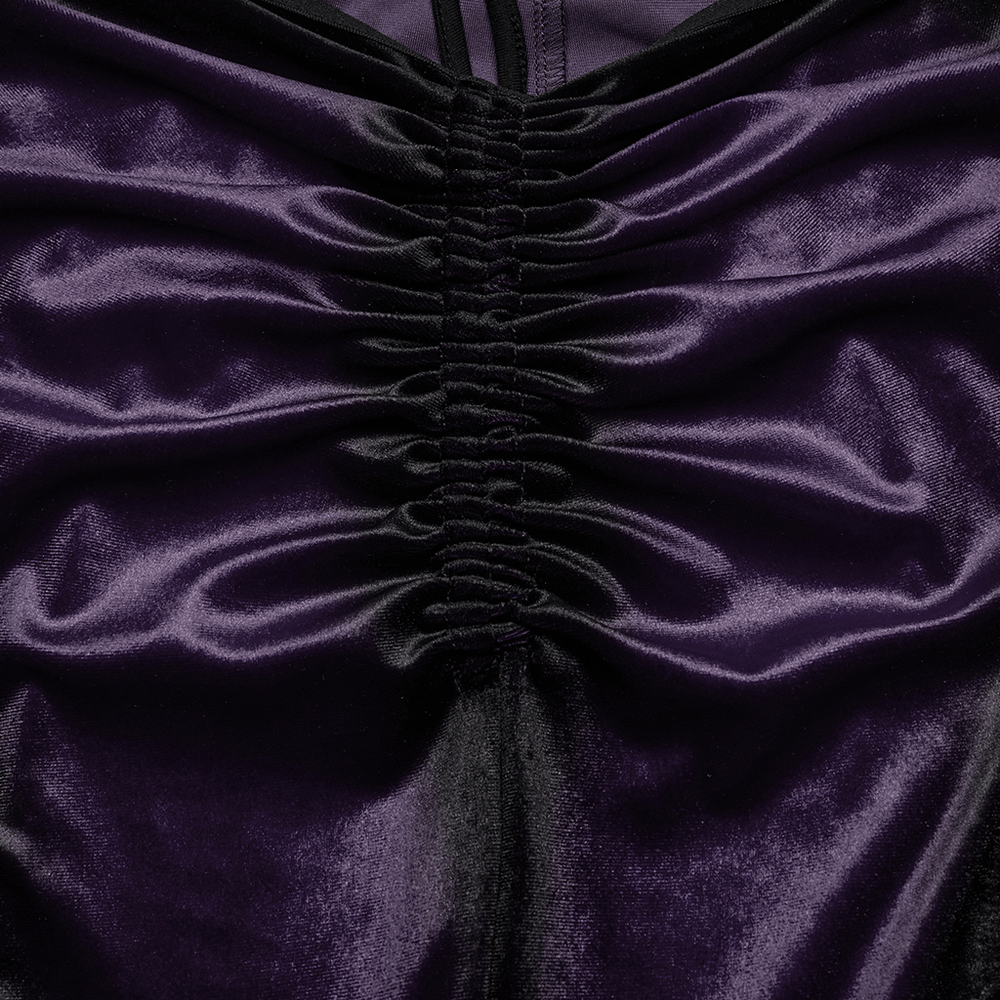 Close-up of gothic velvet fabric with ruching detail in deep purple, showcasing its soft texture and elegant design.