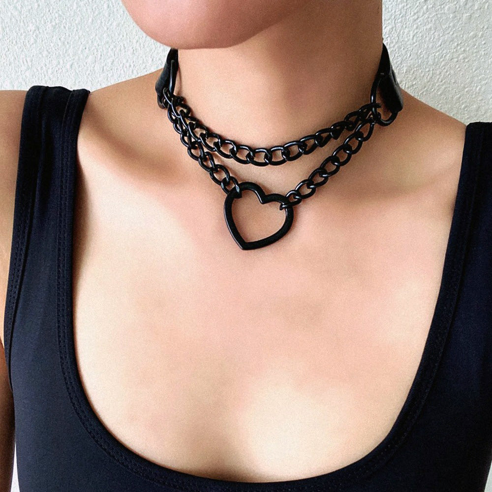 Black heart chain choker necklace on female model, perfect gothic accessory for Halloween.