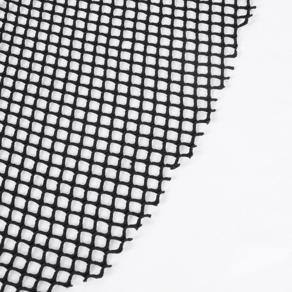 close-up of black fishnet fabric with a textured grid pattern perfect for gothic fashion and styling.