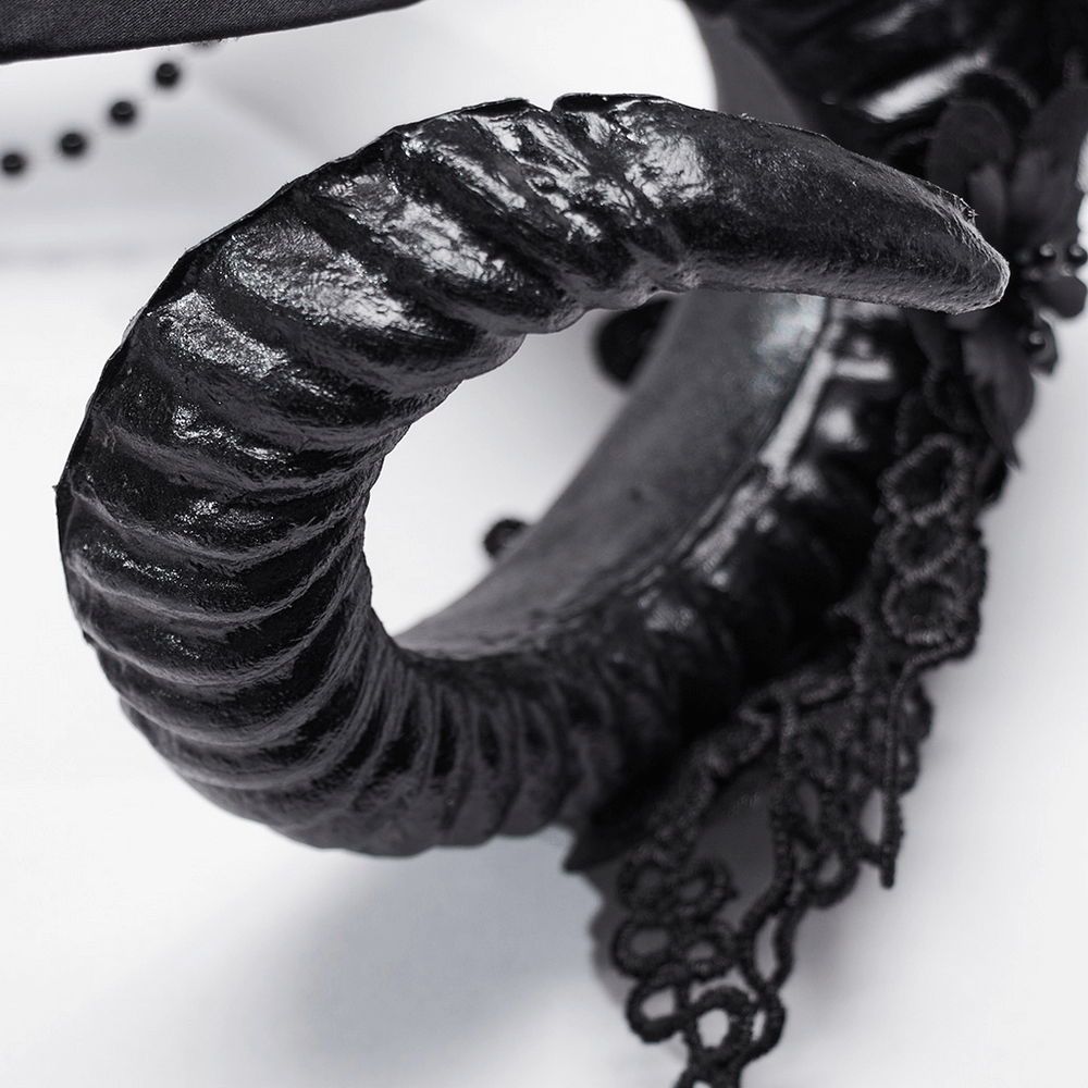 Intricate black gothic horn detail of a floral headdress with lace accents for a striking dark look.