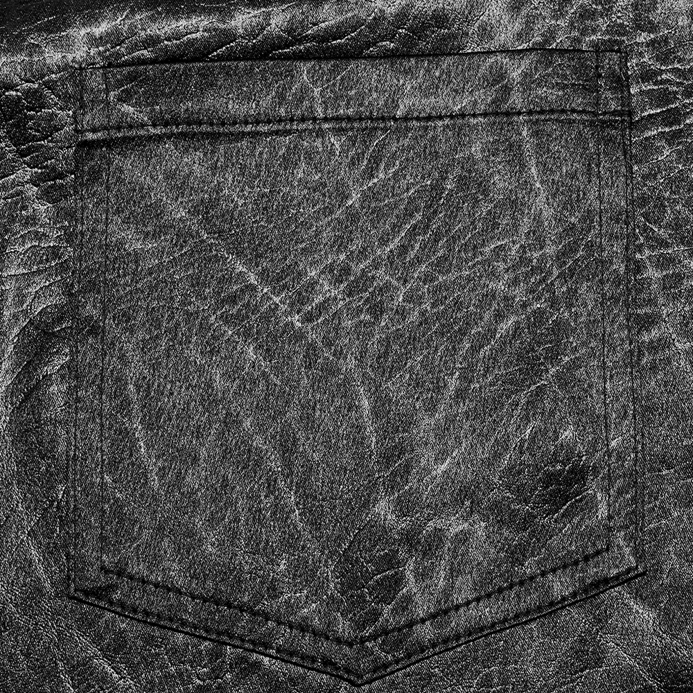 Textured black fabric close-up featuring a minimalist pocket design for stylish clothing.