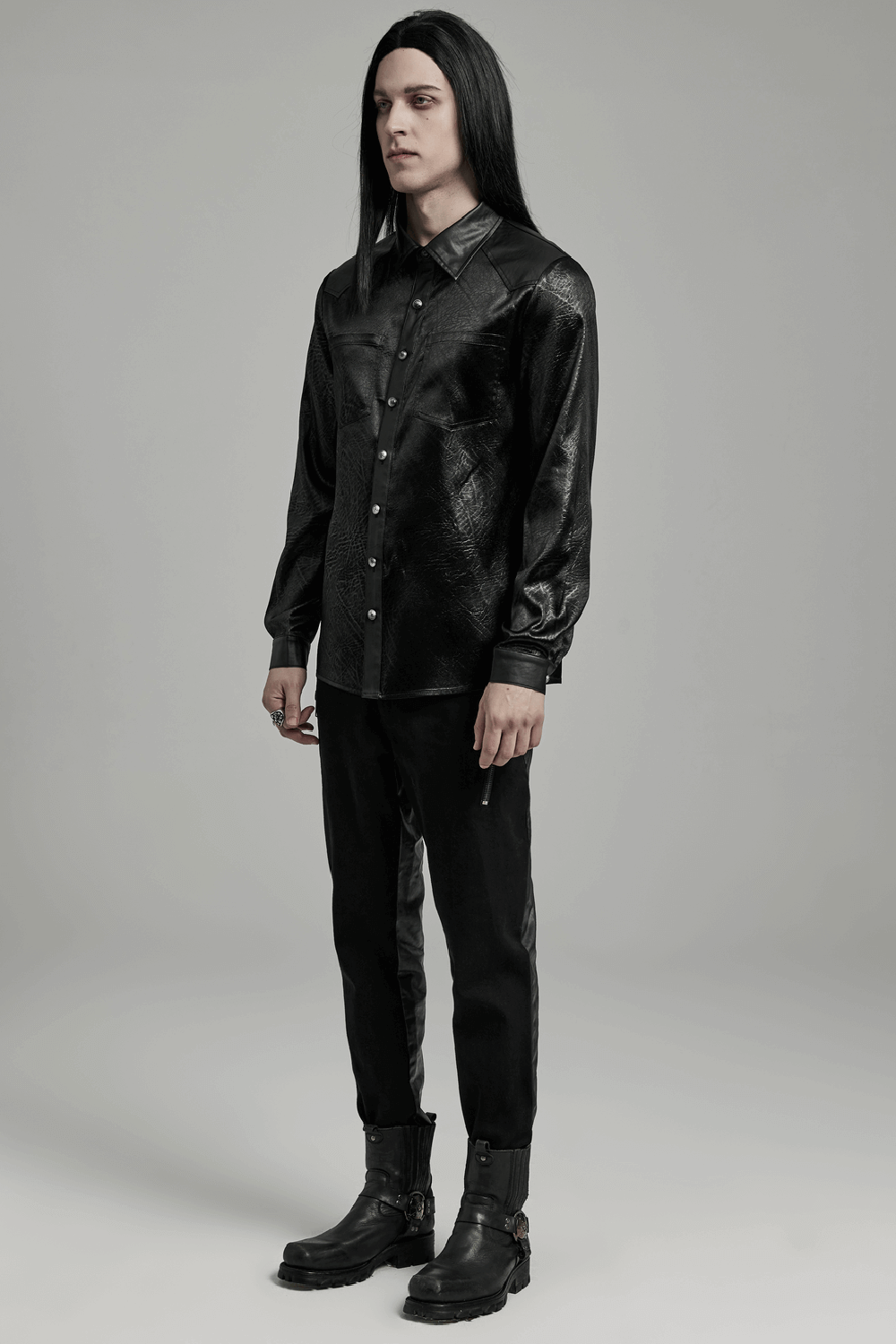 Gothic black shirt with splicing design, paired with sleek pants and boots for an edgy minimalist style.