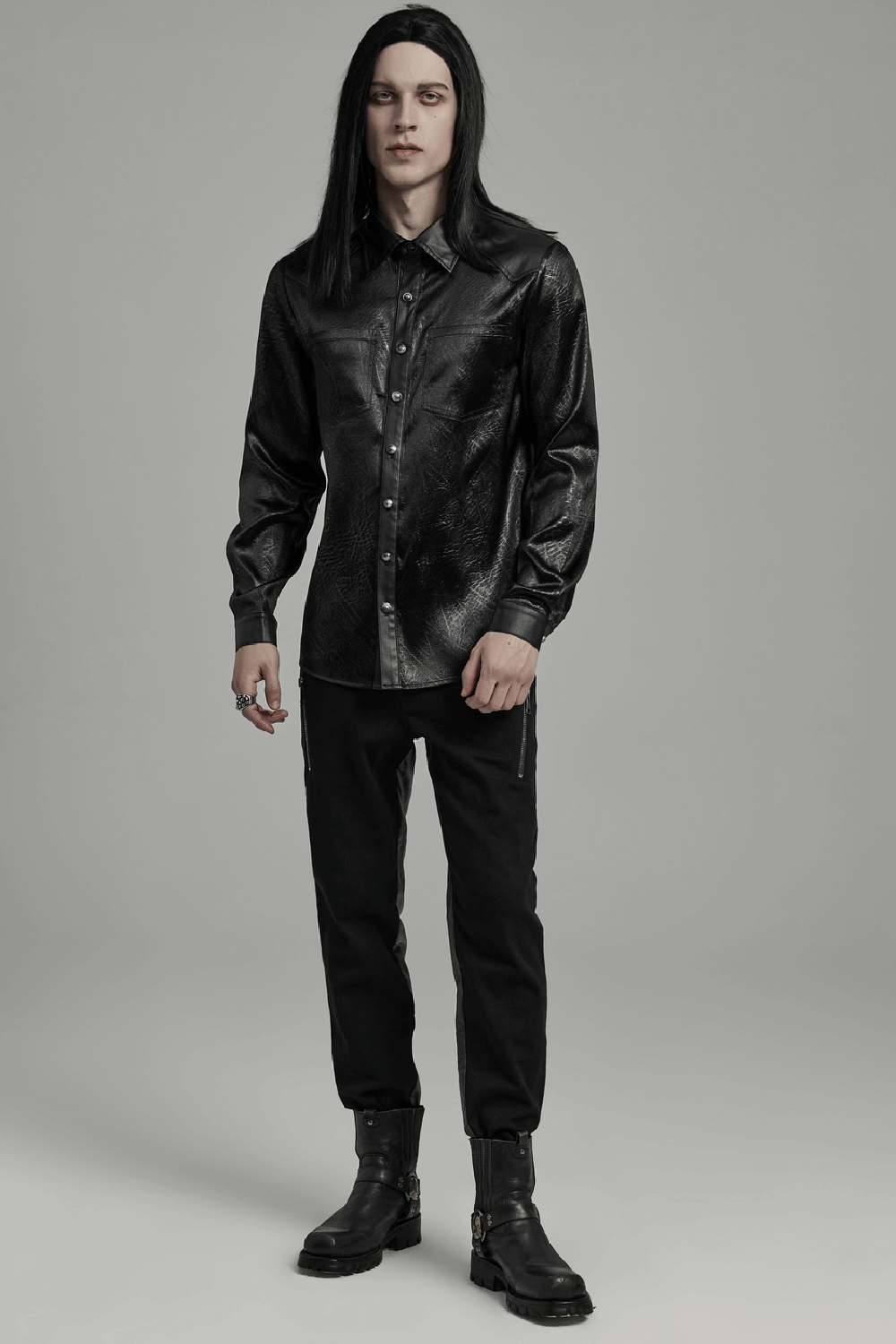 Gothic black shirt with splicing design on shoulders, paired with black pants and boots for an edgy alternative look.