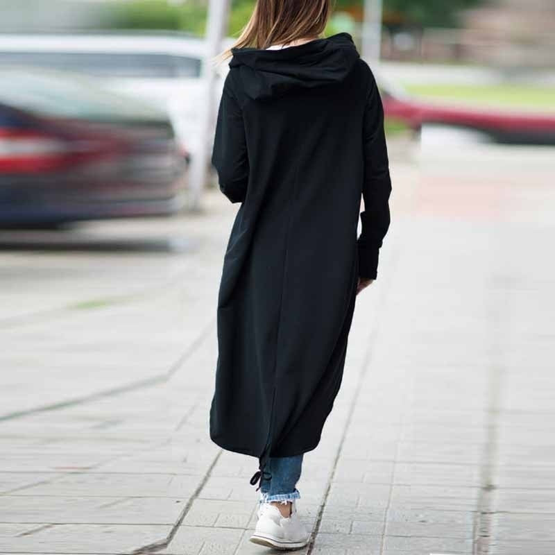 Back view of a woman wearing a black hooded trench coat, perfect for alternative fashion and Gothic style outfits.