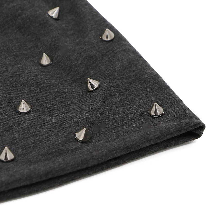 Close-up of a black beanie hat featuring silver studs for a rock and metal alternative fashion style.