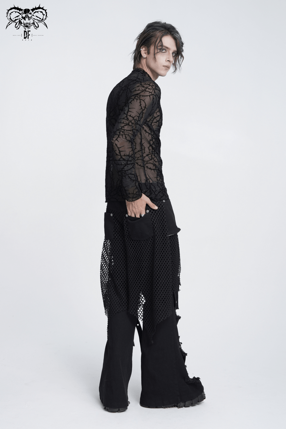 Alternative Sheer Mock Neck Top with Barbed Vine Pattern worn by a model in a dramatic pose against a plain background.