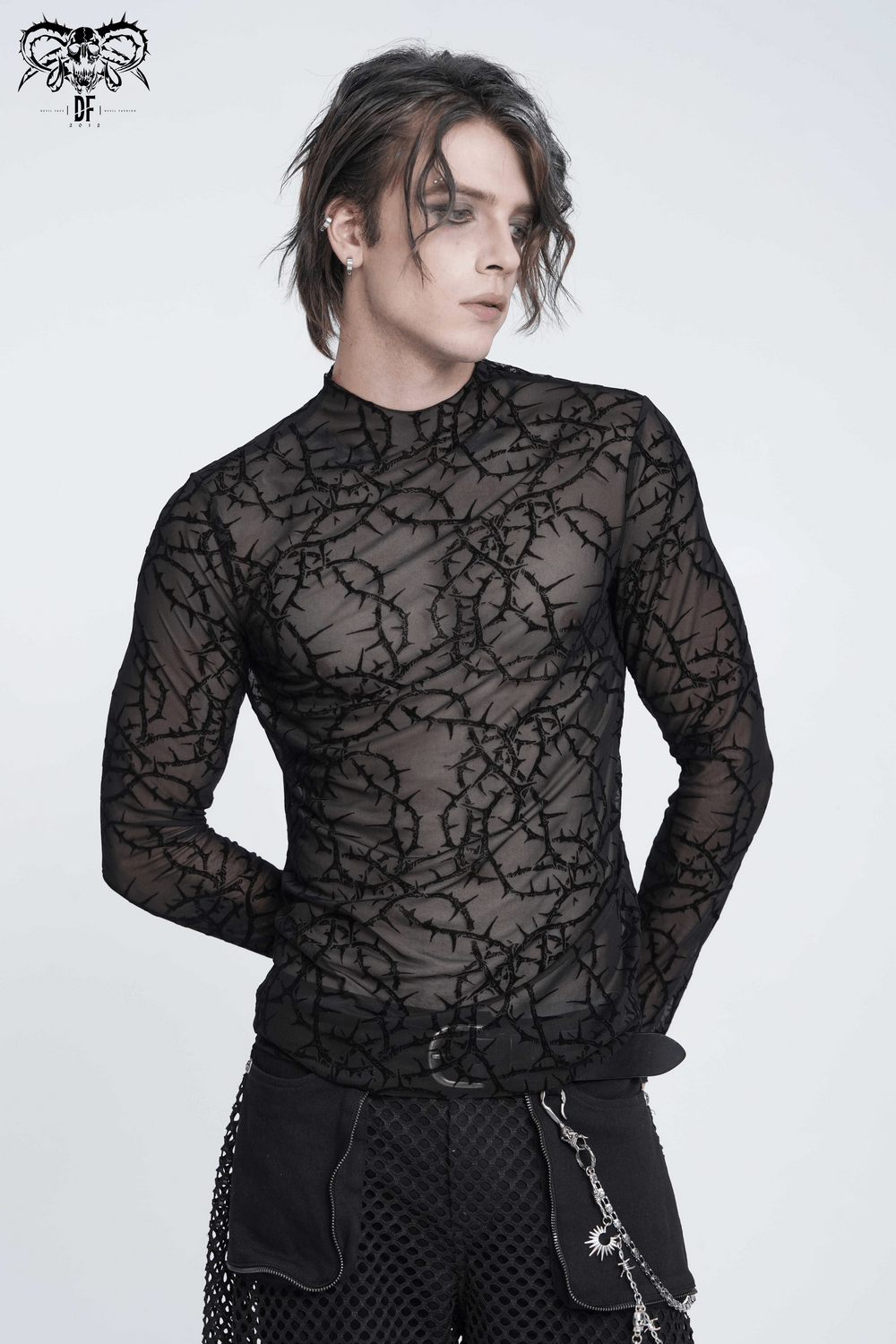 Alternative Sheer Mock Neck Top with Barbed Vine Pattern showcased by a model, featuring a stylish and edgy design.