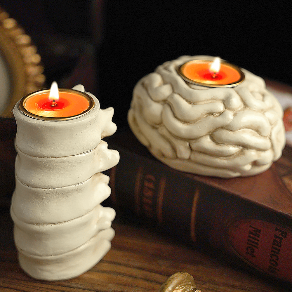 Anatomy Candle Holder for Gothic Horror Decor featuring spine and brain candle holders with flickering flames.
