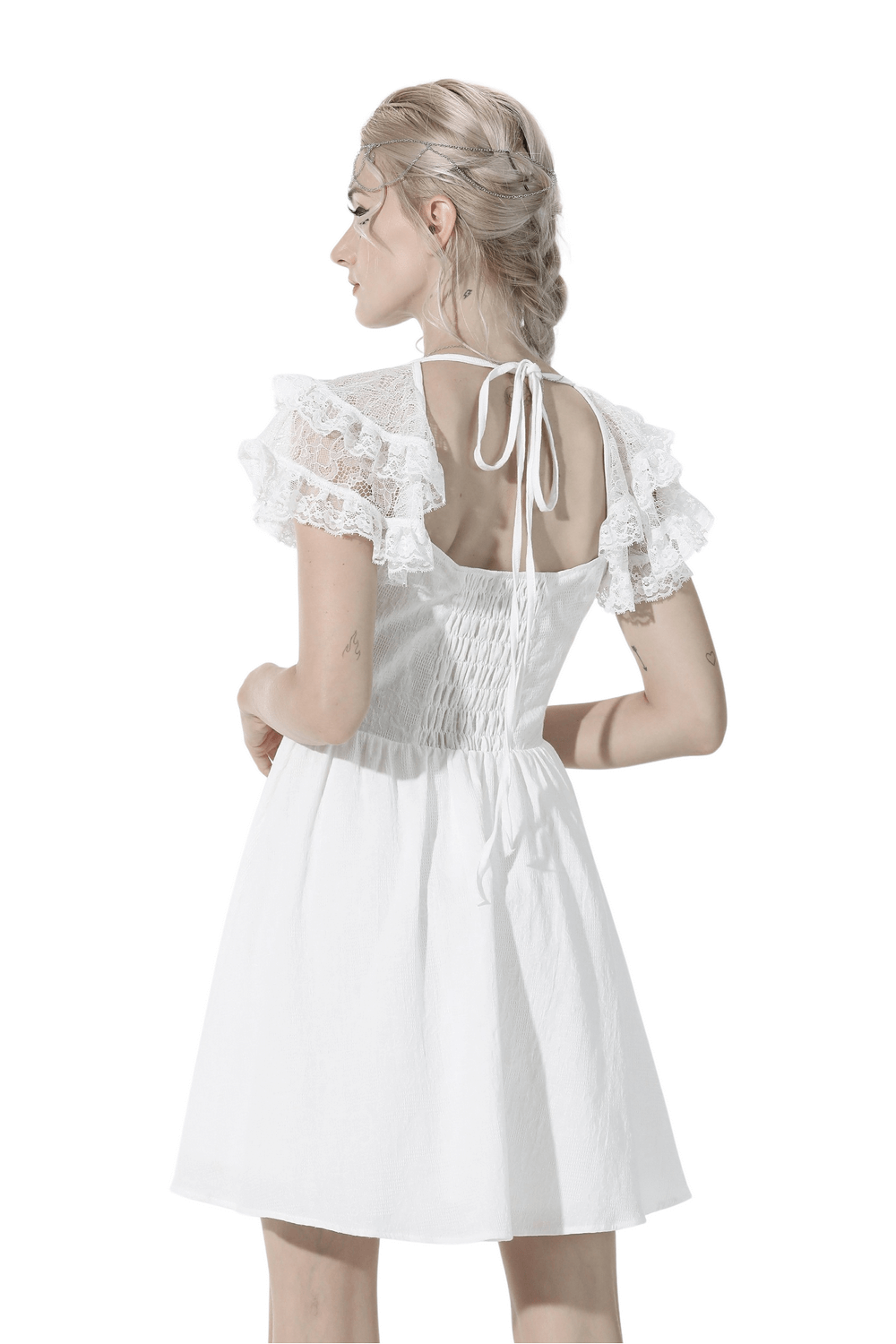 Back view of Gothic Lolita white lace mini dress with ruffled sleeves and cross-chest design, showcasing elegant beading details.