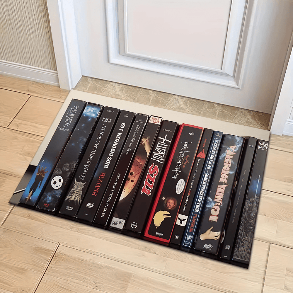 Anti-slip Smoke Gothic Floor Mat for Home Decor with gothic skull design and movie VHS motifs near a door.