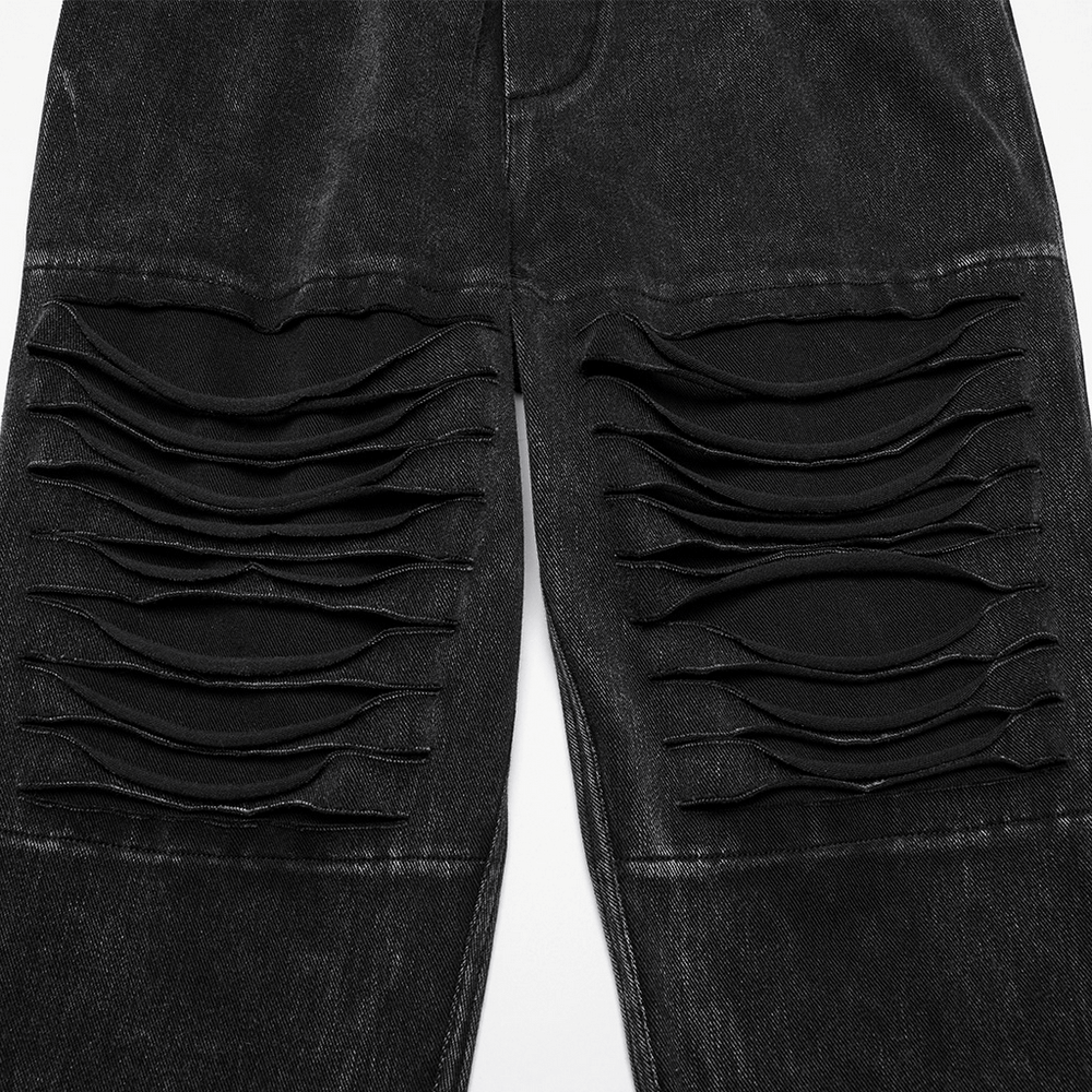 Detailed view of distressed black knitted jeans featuring unique knife-cut design and elastic denim material.