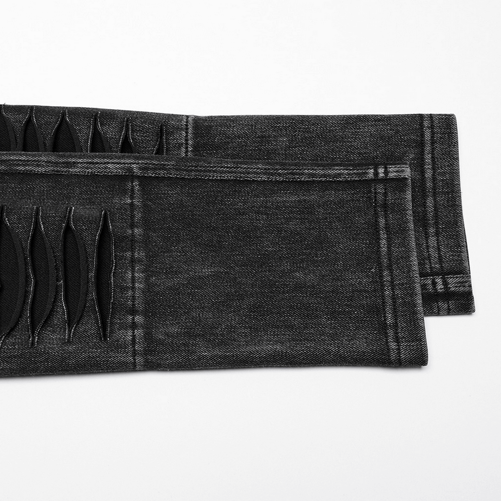 Close-up of ripped detailing on Apocalypse Punk distressed black knitted jeans, featuring a unique knife-cut design.