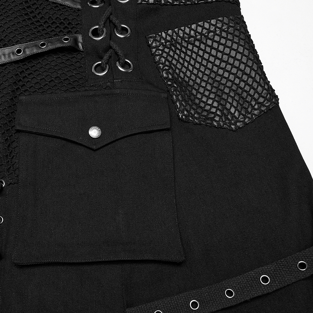 Close-up of an asymmetric male gothic skirt featuring metal snaps and unique textured pockets.