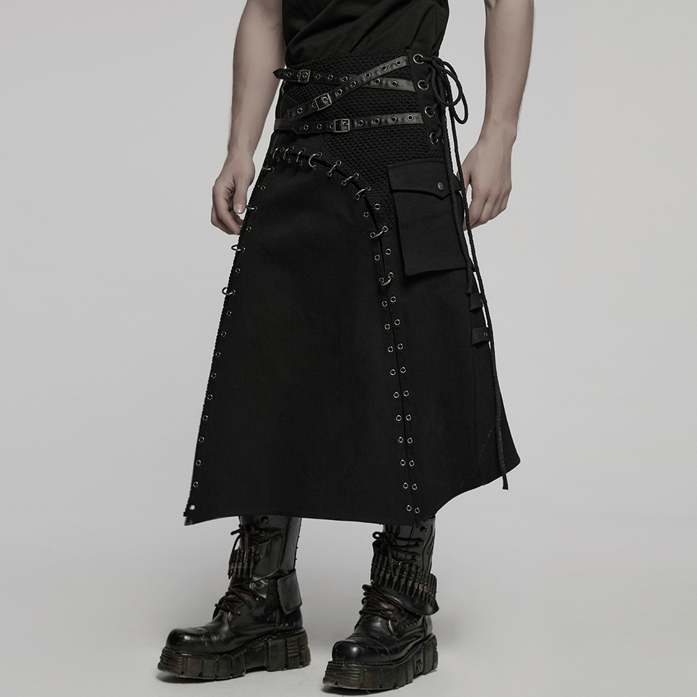 Asymmetric male gothic skirt featuring metal snap accents and pocket details, styled with chunky black boots.