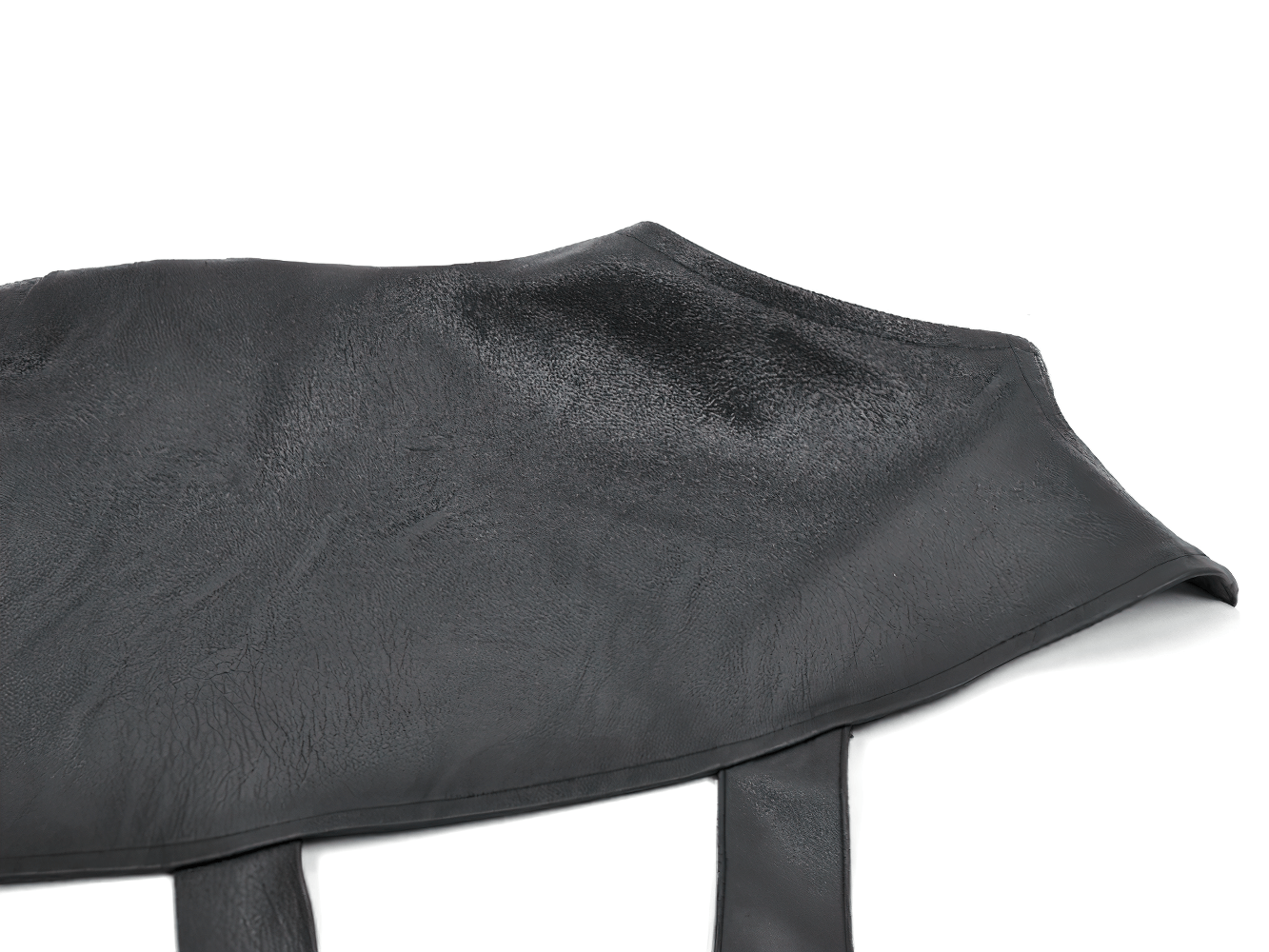 Asymmetric Punk Leather Shoulder Cape with Strap Detailing showcasing unique texture and design features.