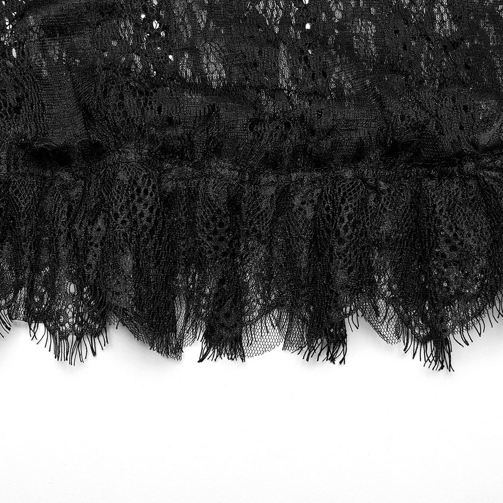 Close-up of luxurious black lace trim with intricate patterns for a gothic-inspired skirt.