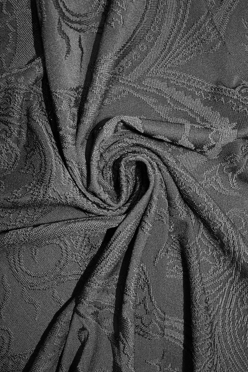 Elegant black lace fabric showcasing intricate patterns, perfect for gothic style dresses.