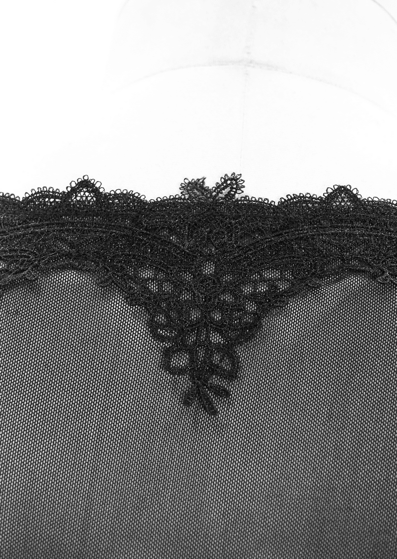 Close-up of intricate black lace detailing on the neckline of a gothic dress, showcasing elegant floral patterns.