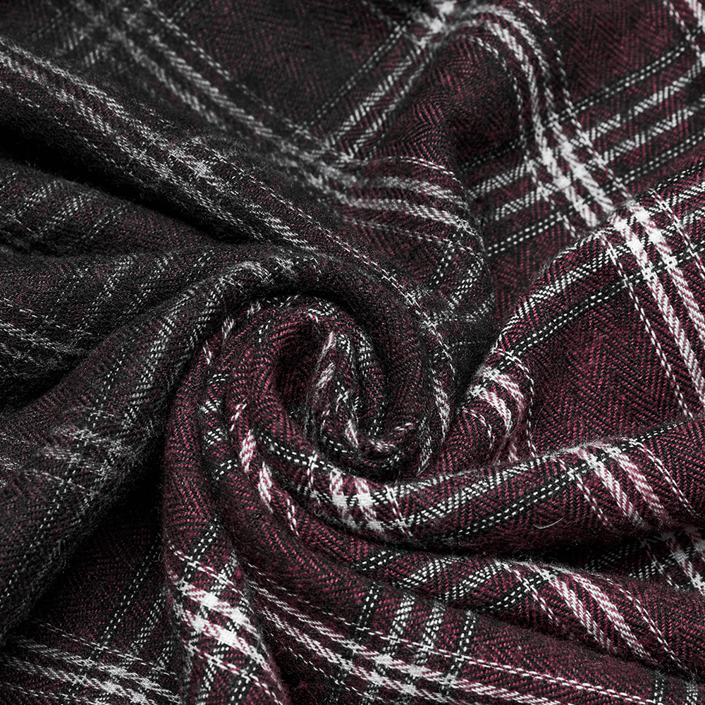 Close-up of gothic plaid fabric in shades of burgundy and black, perfect for edgy fashion pieces like skirts.