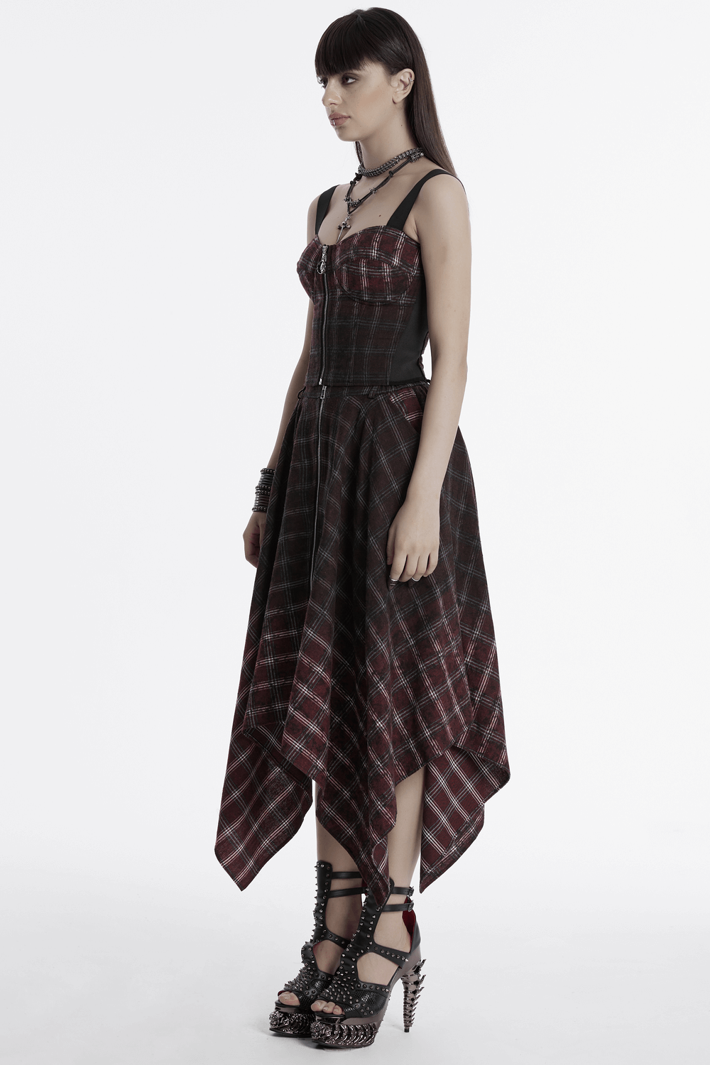 Asymmetrical Gothic plaid skirt with zipper front, showcasing punk-inspired design and irregular hemline.