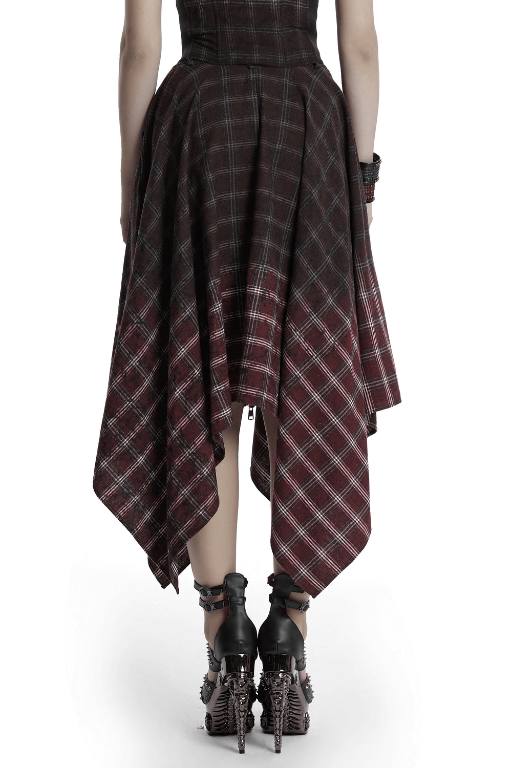 Back view of asymmetrical gothic plaid skirt with zipper front and irregular hem, showcasing punk style.