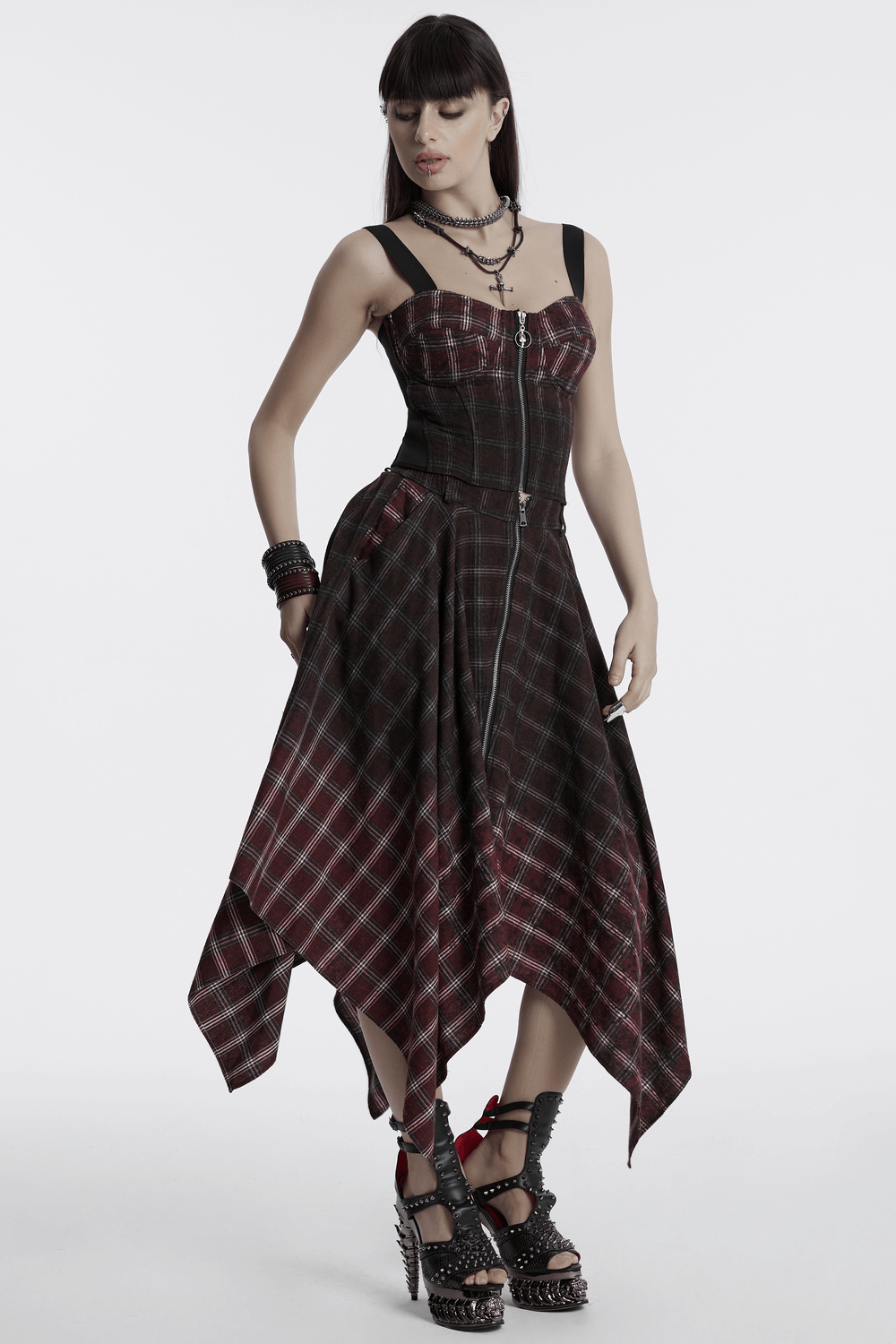 Asymmetrical Gothic plaid skirt with zipper front, featuring edgy tie-dye fabric and irregular hem style.