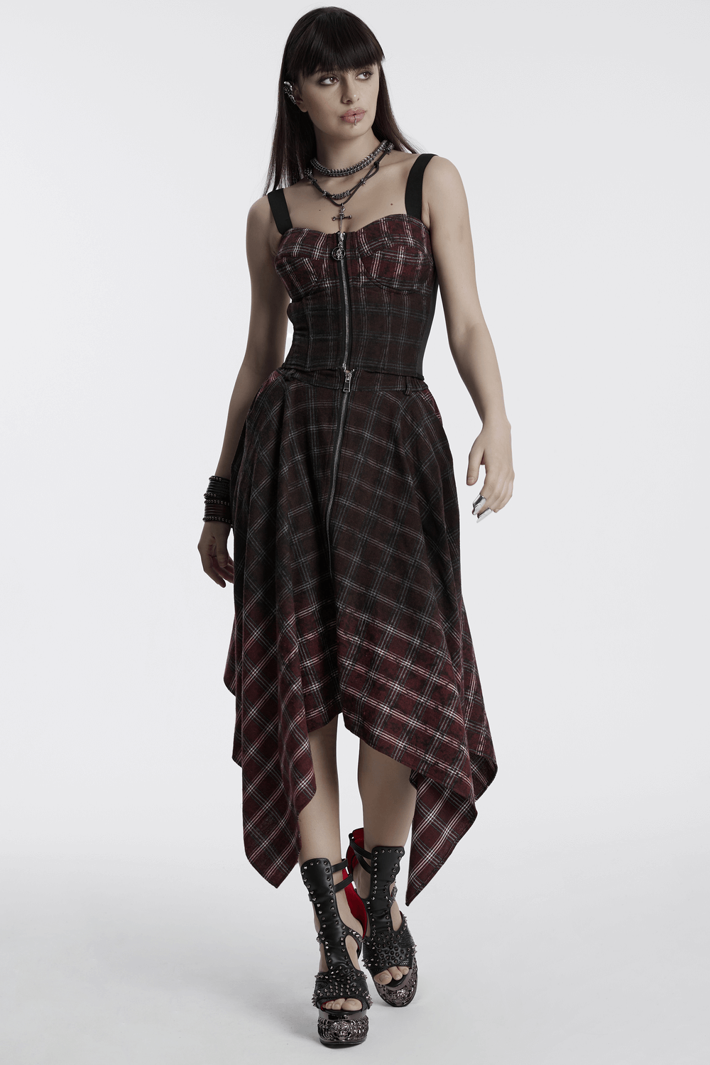 Asymmetrical gothic plaid skirt with front zipper, featuring an edgy irregular hem and punk-inspired design.