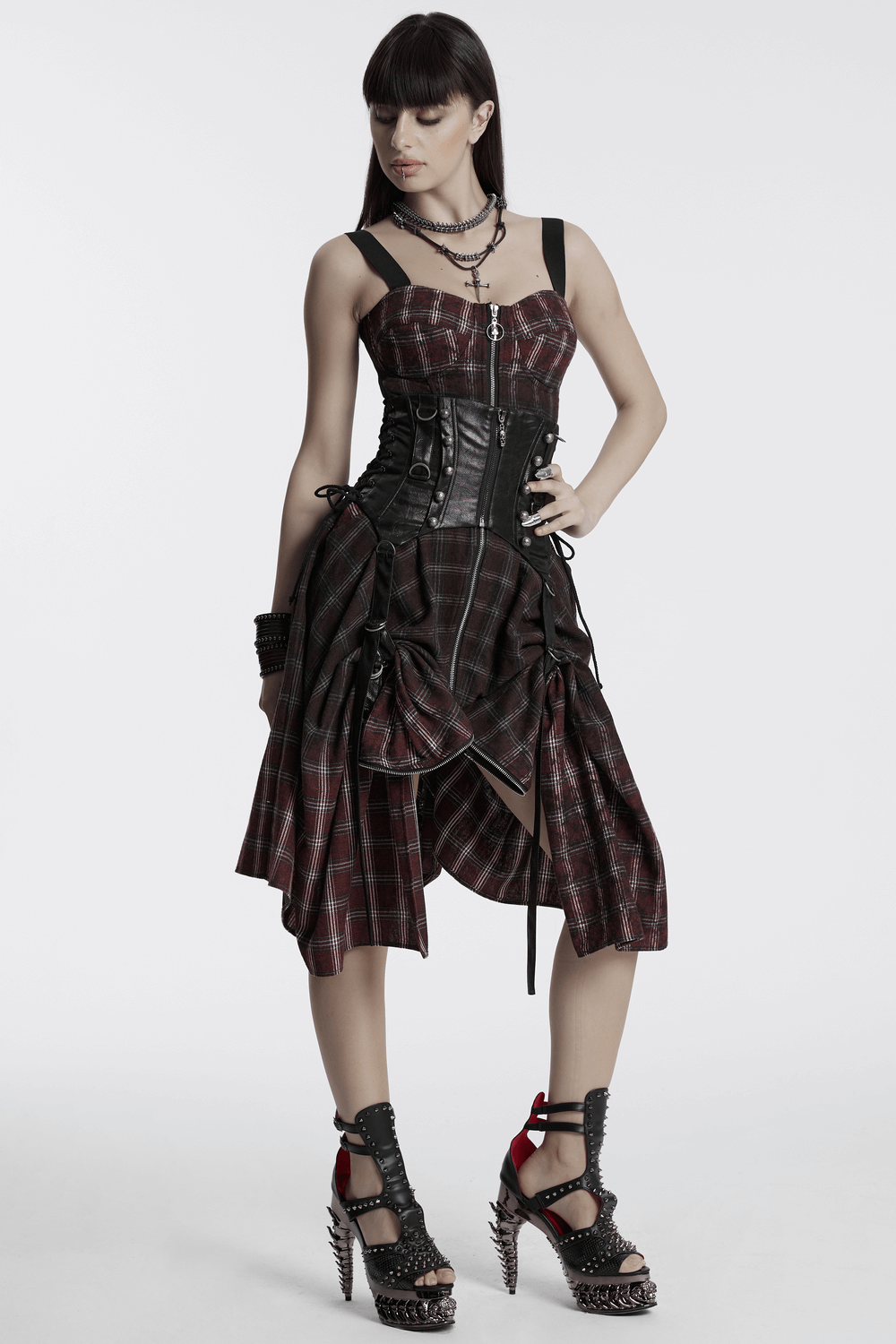 Asymmetrical Gothic plaid skirt with zipper front and edgy design, featuring an irregular hem and punk-inspired vibe.