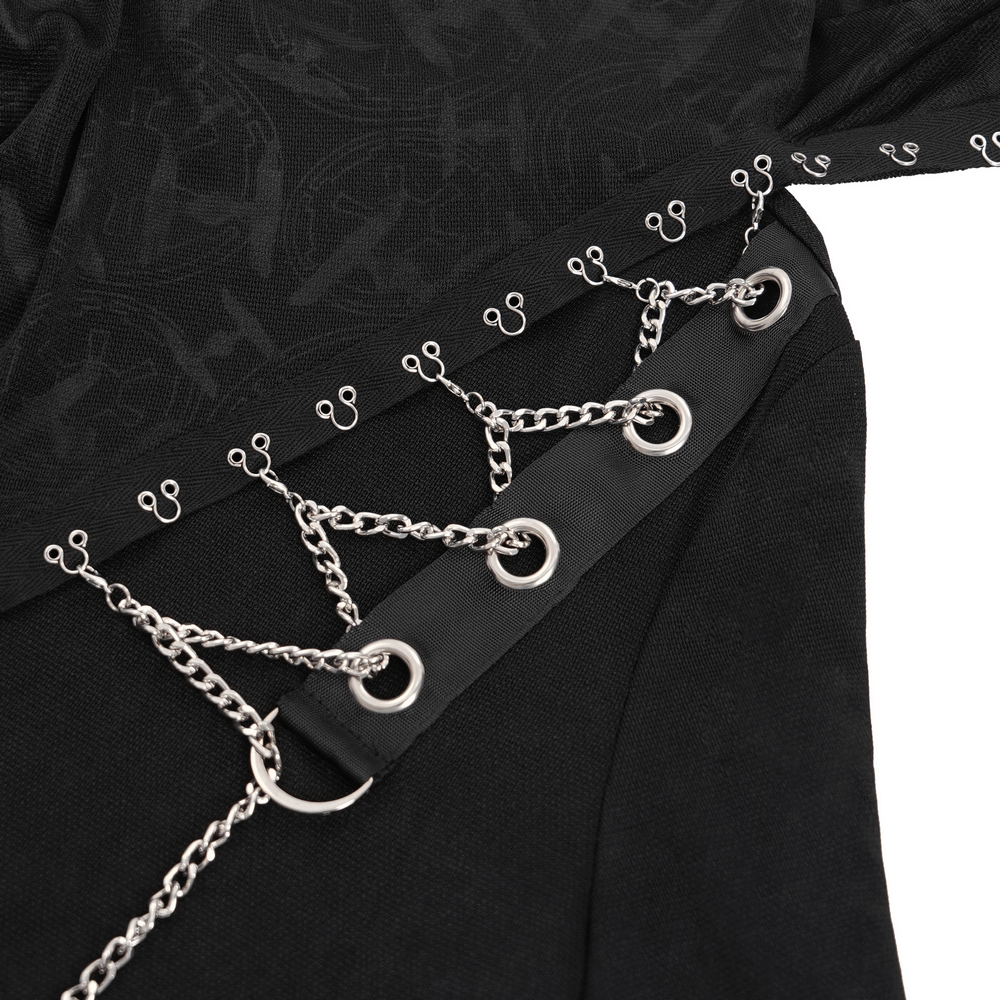 Close-up of gothic top featuring silver chains and unique lace accents for a bold dark aesthetic.