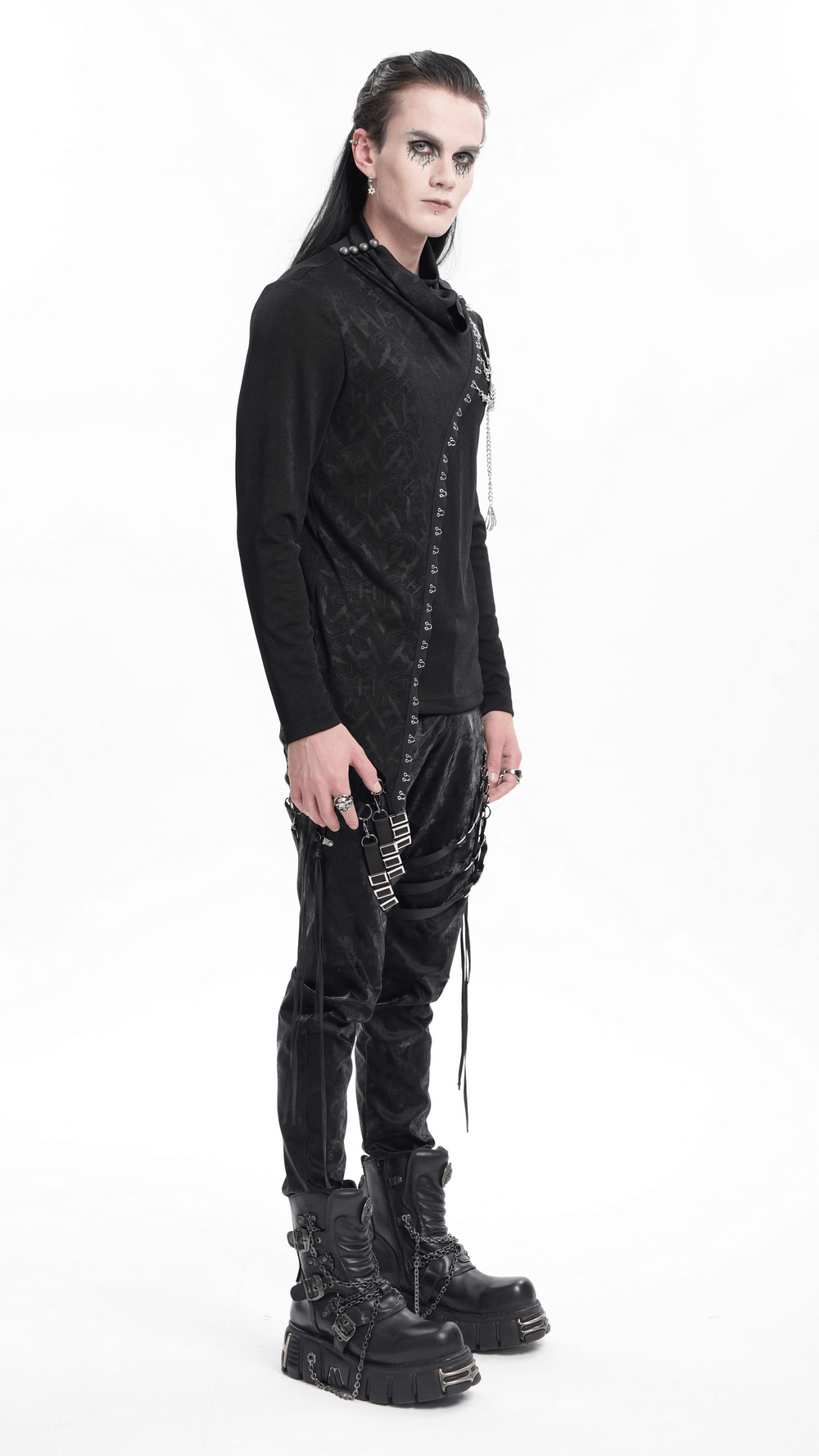 Asymmetrical gothic top with chain detailing and unique lace accents, styled in a dark punk fashion.