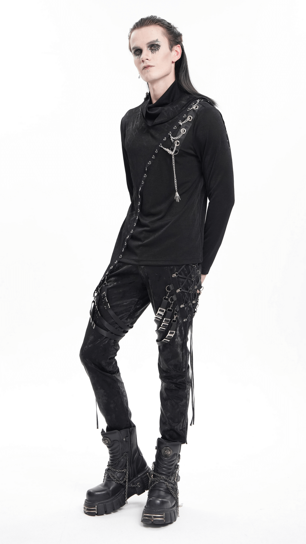 Dark punk outfit featuring asymmetrical long-sleeve top with chains, layered look, and edgy black pants. Perfect for a gothic vibe.