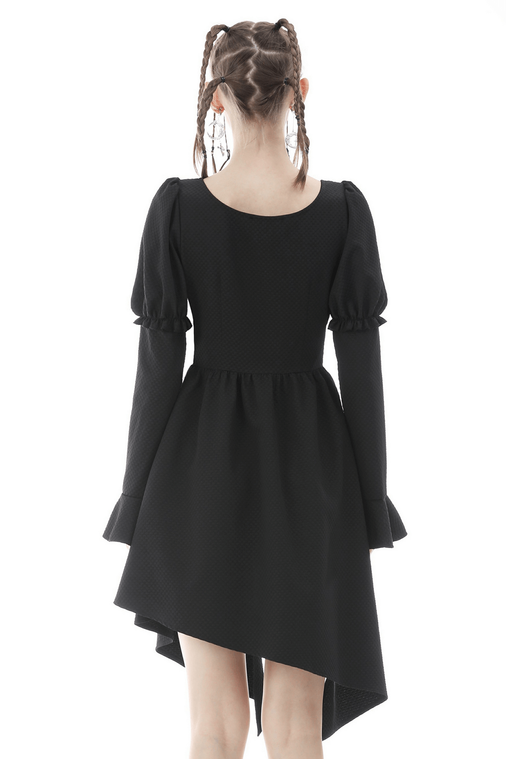 Elegant back view of an asymmetrical hem black dress with long sleeves and puffed shoulders, exuding modern chic.