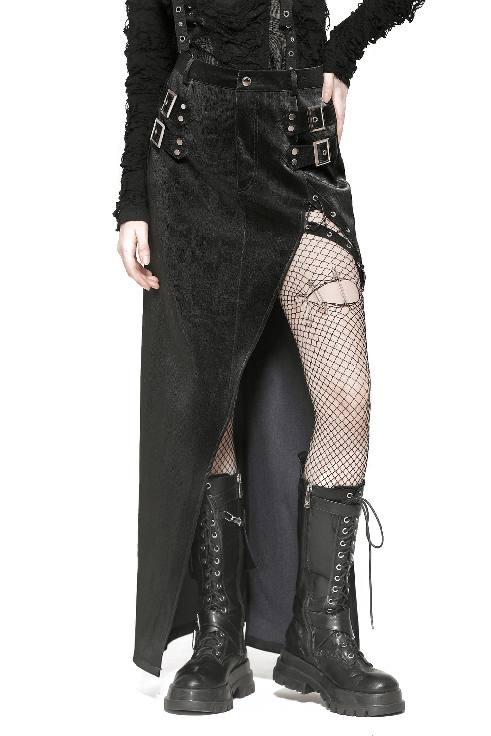 Asymmetrical black PU leather skirt with buckles, lacing, and daring slit, styled with fishnet stockings and combat boots.