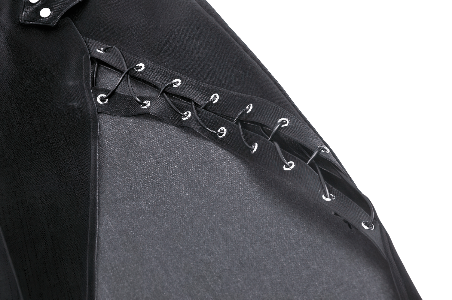 Close-up of lace-up detail on asymmetrical black PU leather skirt, showcasing edgy style and craftsmanship.