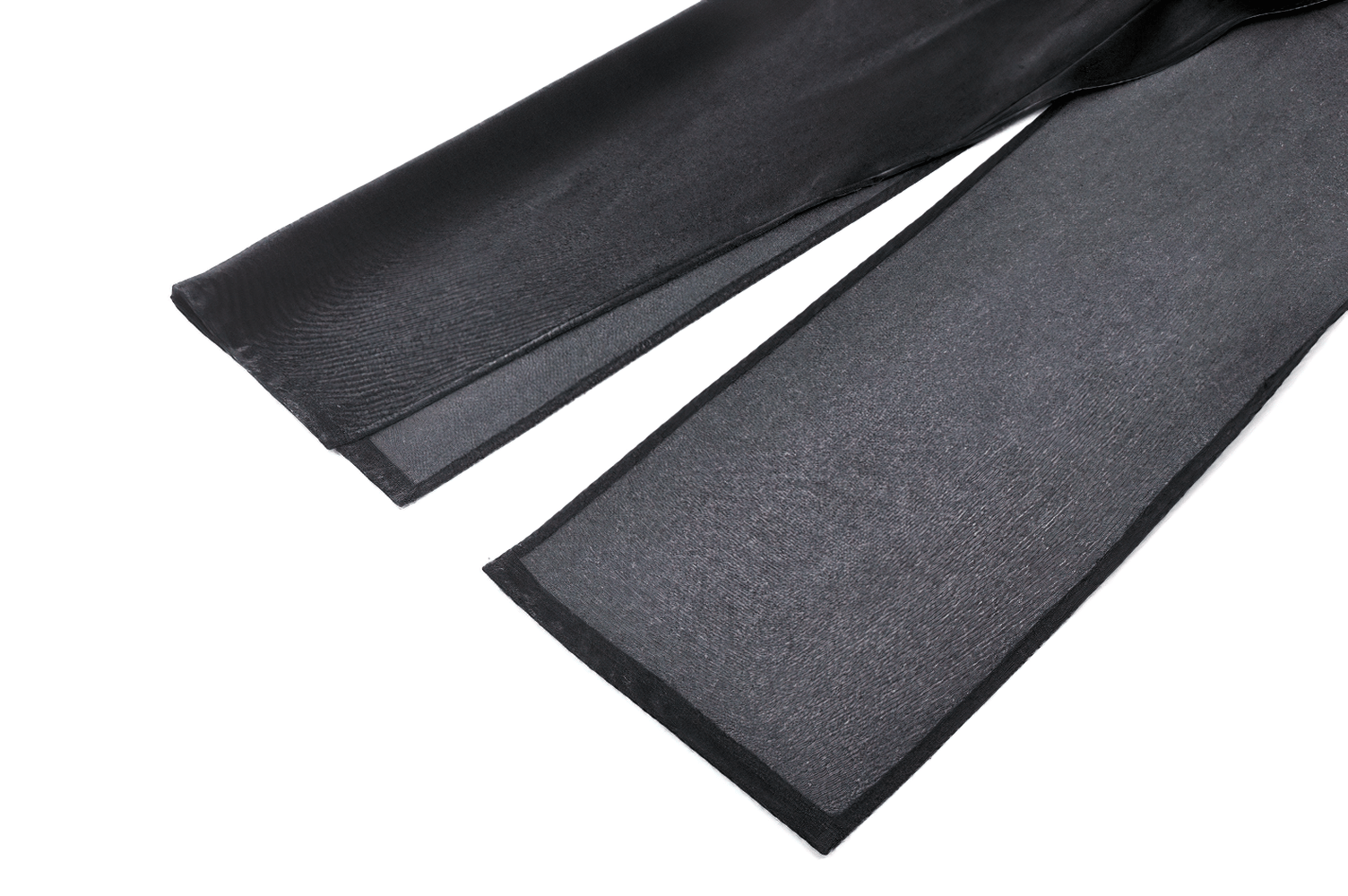 close-up of sleek black fabric sections highlighting a soft and sheer texture for modern fashion designs