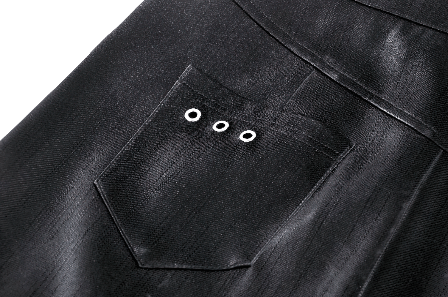 Close-up of the pocket on a black asymmetrical PU leather skirt with eyelet details. Perfect for edgy fashion styles.